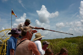 Robert Tigertail gives a tour of ancestral territory on the Miccosukee Reservation in the Florida Everglades on June 25, 2023. Credit: Lisette Morales McCabe/The Washington Post via Getty Images