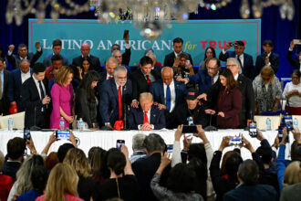 President-elect Donald Trump prays during a roundtable discussion with Latino community leaders at Trump National Doral Miami resort in Miami on Oct. 22. Credit: Chandan Khanna/AFP via Getty Images