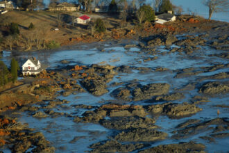 A view of homes along the Emory River near Kingston, Tennessee, following the TVA coal ash disaster in December 2008. Credit: Courtesy of Appalachian Voices/Dot Griffith with flight by Southwings