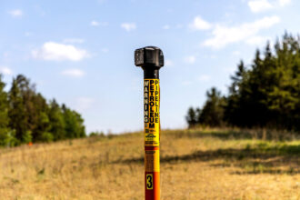 A marker for the Enbridge Line 3 pipeline is seen in Park Rapids, Minn. The pipeline runs from Alberta, Canada to Superior, Wisconsin. Credit: Kerem Yucel/AFP via Getty Images