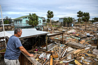 David Hester inspects damage to his house after Hurricane Helene made landfall on Sept. 28 in Horseshoe Beach, Fla. Credit: Chandan Khanna/AFP via Getty Images