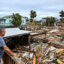 David Hester inspects damage to his house after Hurricane Helene made landfall on Sept. 28 in Horseshoe Beach, Fla. Credit: Chandan Khanna/AFP via Getty Images