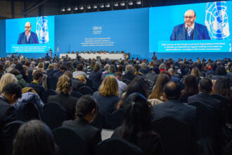 Guests listen as Chair Luis Vayas Valdivieso speaks during the opening of the fifth session of the U.N. Intergovernmental Negotiating Committee on Plastic Pollution (INC-5) in Busan, South Korea on Nov. 25. Credit: Anthony Wallace/AFP via Getty Images