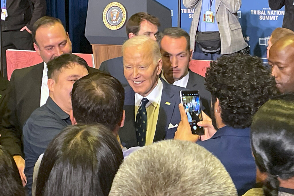 Tribal leaders and representatives surround President Joe Biden in hopes of greeting him after his remarks at the White House Tribal Nations Summit. Credit: Noel Lyn Smith/Inside Climate News