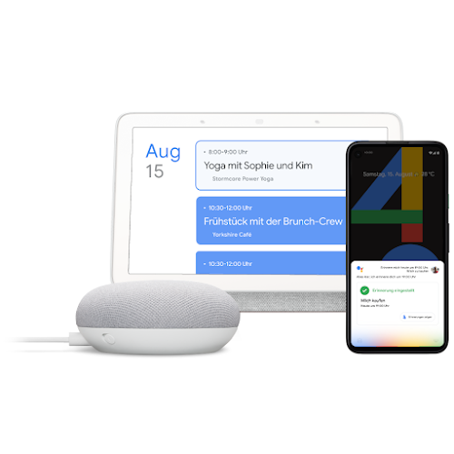 Ein Google Home, ein Laptop und ein Smartphone, auf denen Google Assistant zu sehen ist