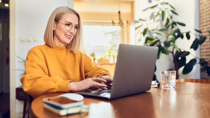 Woman working at home on her laptop. 