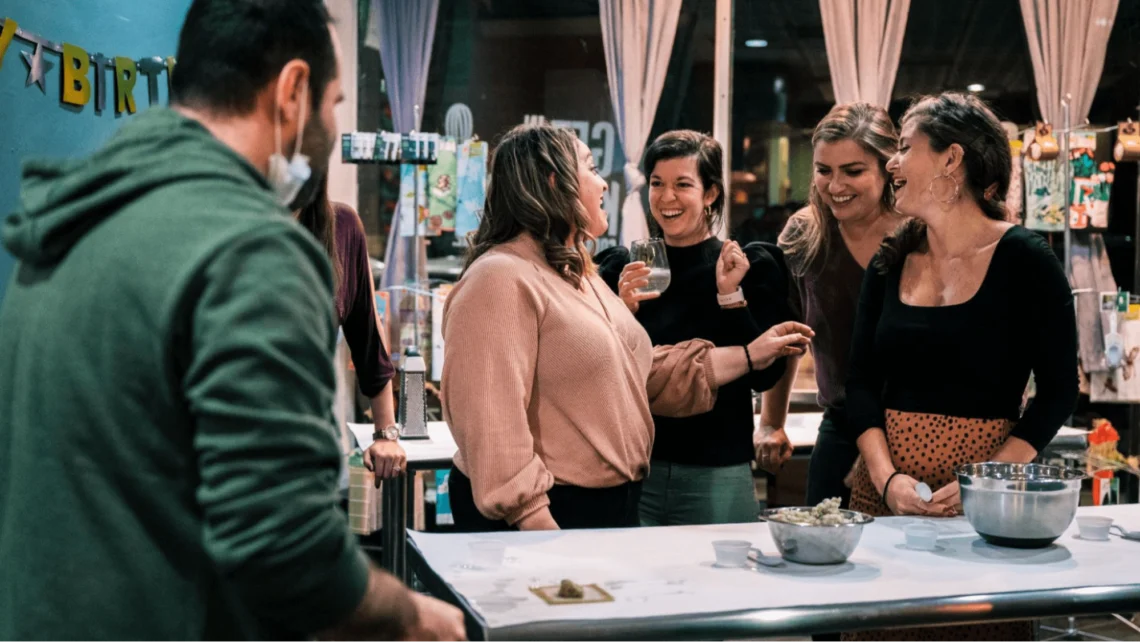 People laughing at a cooking class