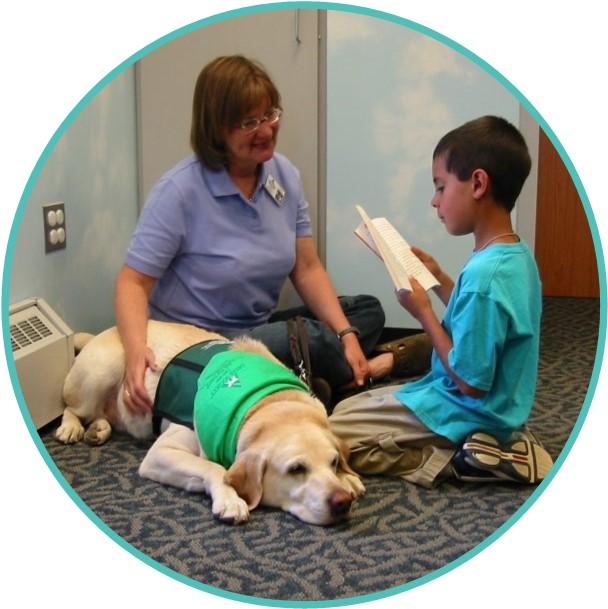 Paws to Read Reading to Therapy Dogs