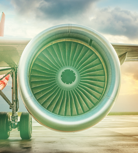 a close up of a plane 's engine on the runway