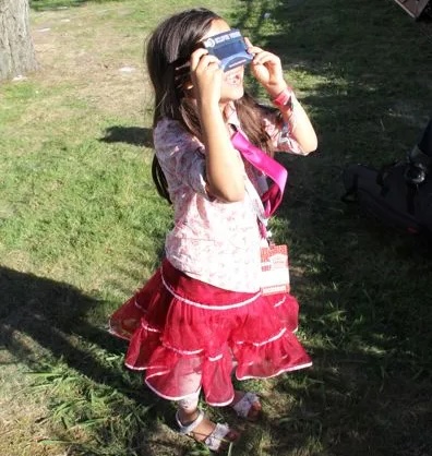 child viewing eclipse