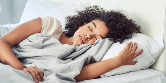 Woman laying in bed sleeping