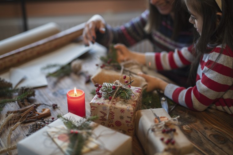 Happy Family Making Christmas Gifts At Home.