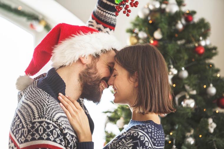 Happy couple under the mistletoe