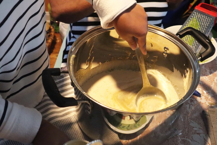 Fabya Lauture mixes ginger syrup into her batch of cremas.