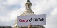 A person holds a sign supporting TikTok at the U.S. Capitol.