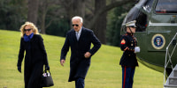 President Joe Biden and first lady Jill Biden walk across the South Lawn of the White House