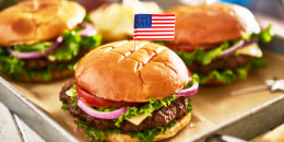 patriotic american cheese burges with flags on tray
