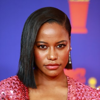 Closeup on Taylour Paige. She is wearing an asymmetrical bob haircut.