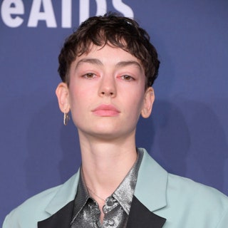 Brigette LundyPaine in a mintgreen tuxedo and silver shirt. she has a short pixie that kind of looks like a bowl cut