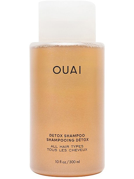 bottle of ouai detox shampoo on a white background