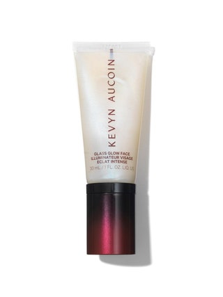 Kevyn Aucoin Glass Glow Face Illuminator tube of white iridescent liquid highlighter with red cap on white background