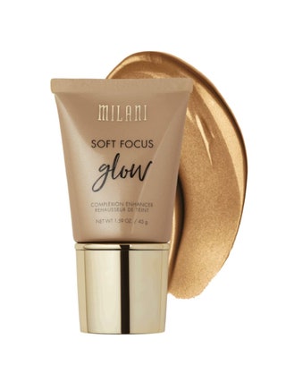 Milani Soft Focus Glow Complexion Enhancer bronze tube of liquid highlighter with gold cap with swatch on white background