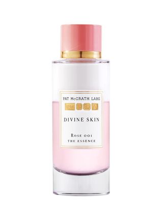 Pat McGrath Labs Divine Skin Rose 001 Essence transparent bottle of pale pink essence with pink cap on white background