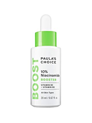 Paula's Choice 10 Niacinamide Booster white serum bottle with green text and green and white dropper top on white background