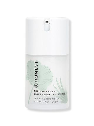 Honest Beauty The Daily Calm Lightweight Moisturizer short white container with pale green leaf and grass design on...