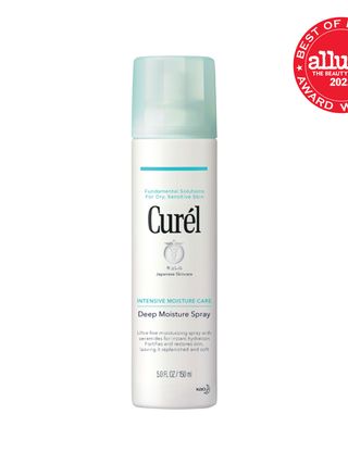 white bottle of Curel Deep Moisture Spray on white background