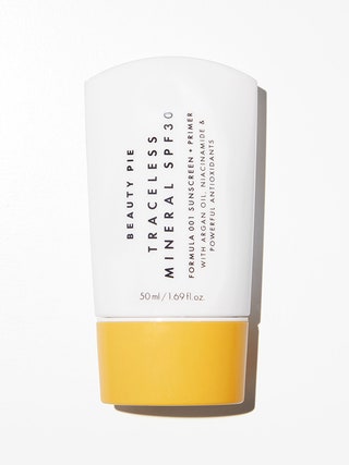 A white tube of the Beauty Pie Traceless SPF 30 Sunscreen  Primer on a white background