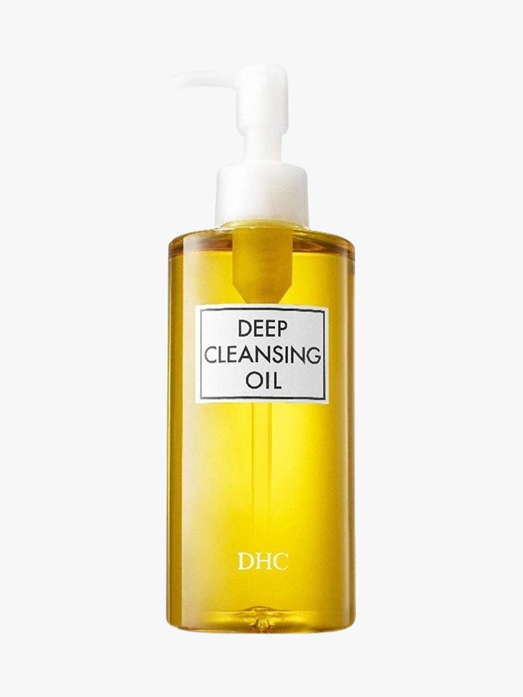 DHC Deep Cleansing Oil yellow bottlw with white top on light grey background