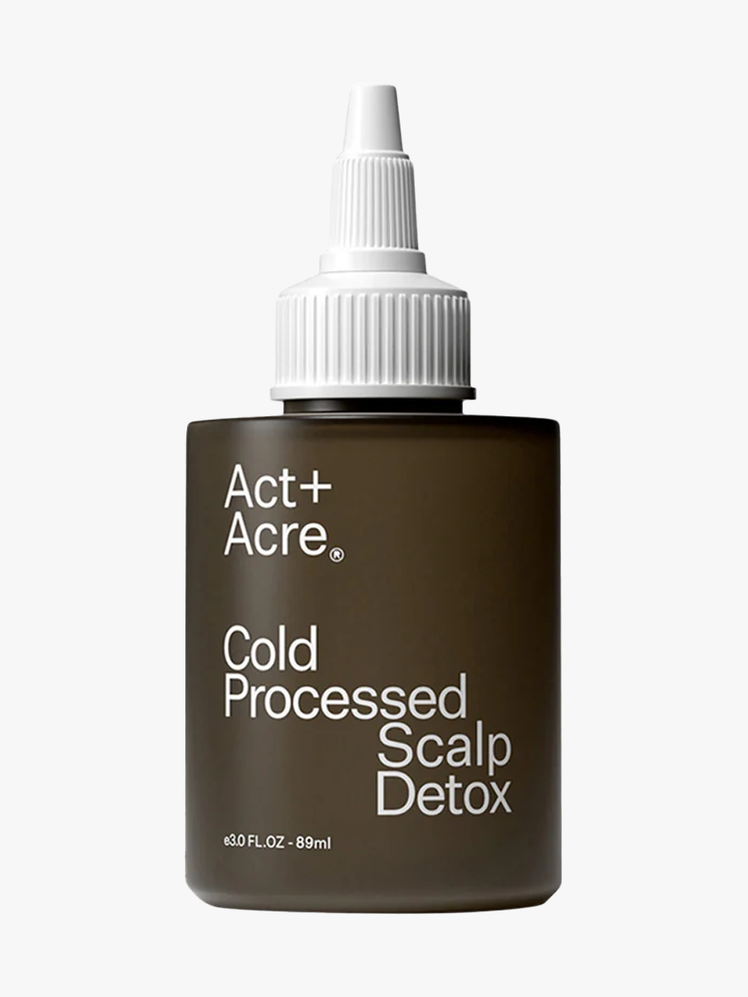 Act + Acre Scalp Detox in muted brown bottle with white applicator cap on light gray background