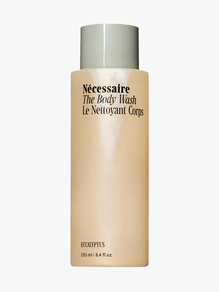 Nécessaire The Body Wash in clear branded bottle with soft mint colored cap on light gray background