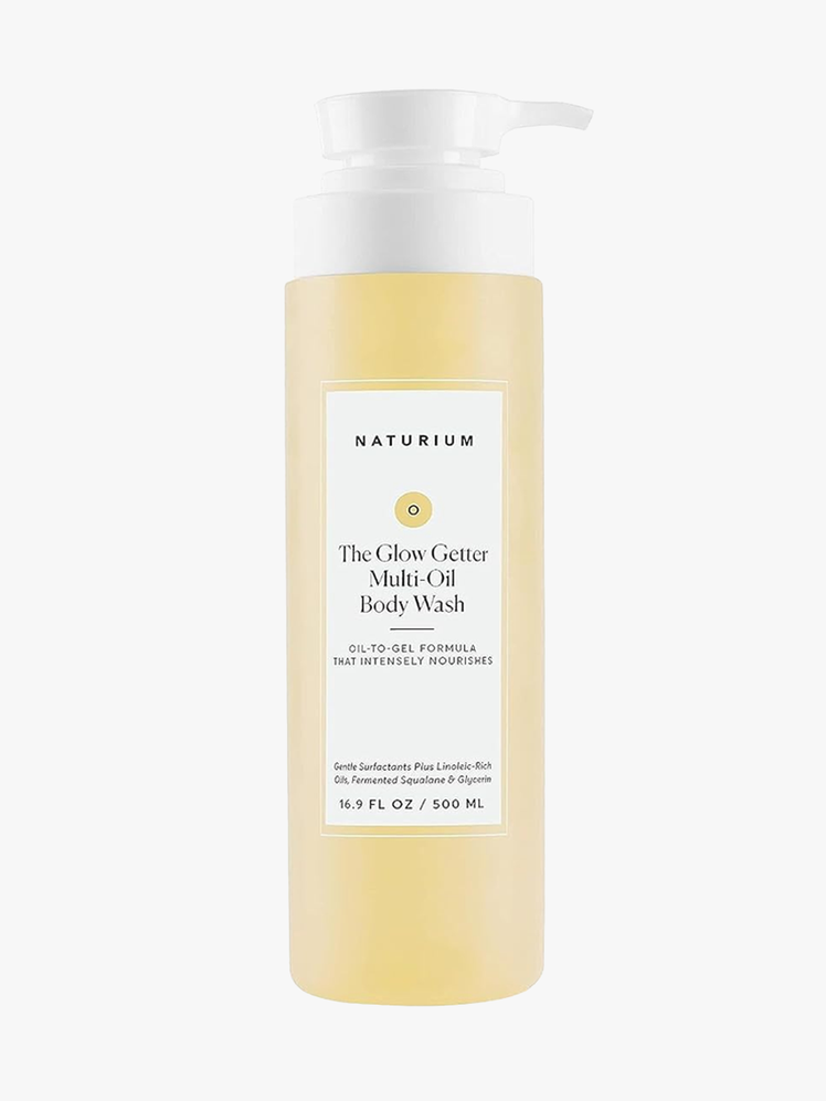 Naturium The Glow Getter Multi-Oil Body Wash in clear bottle with white pump on light gray background