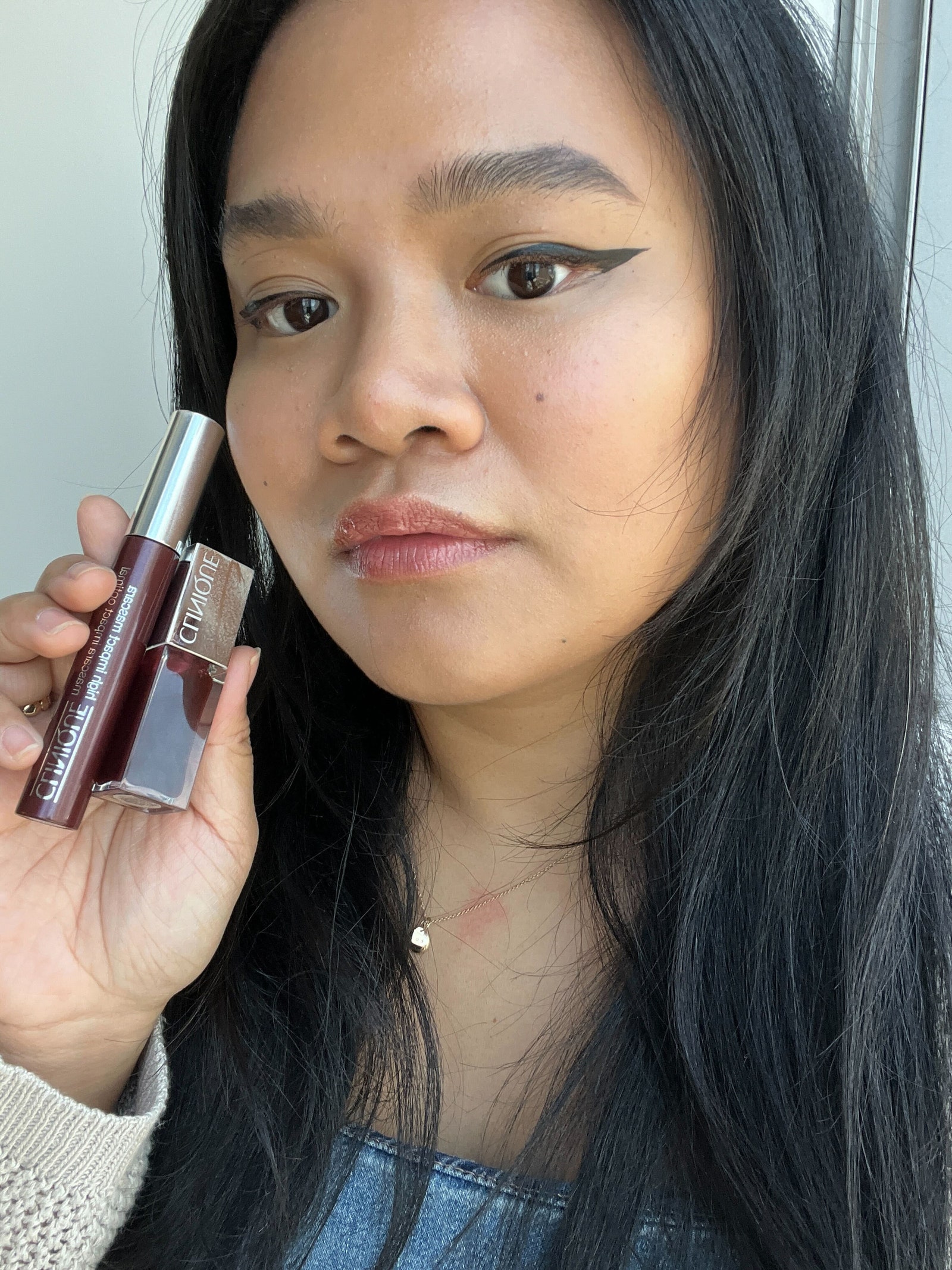 Allure editor Jesa Marie Calaor is wearing Clinique Pop Lip  Cheek Oil in Black Honey on her lips and cheeks and...