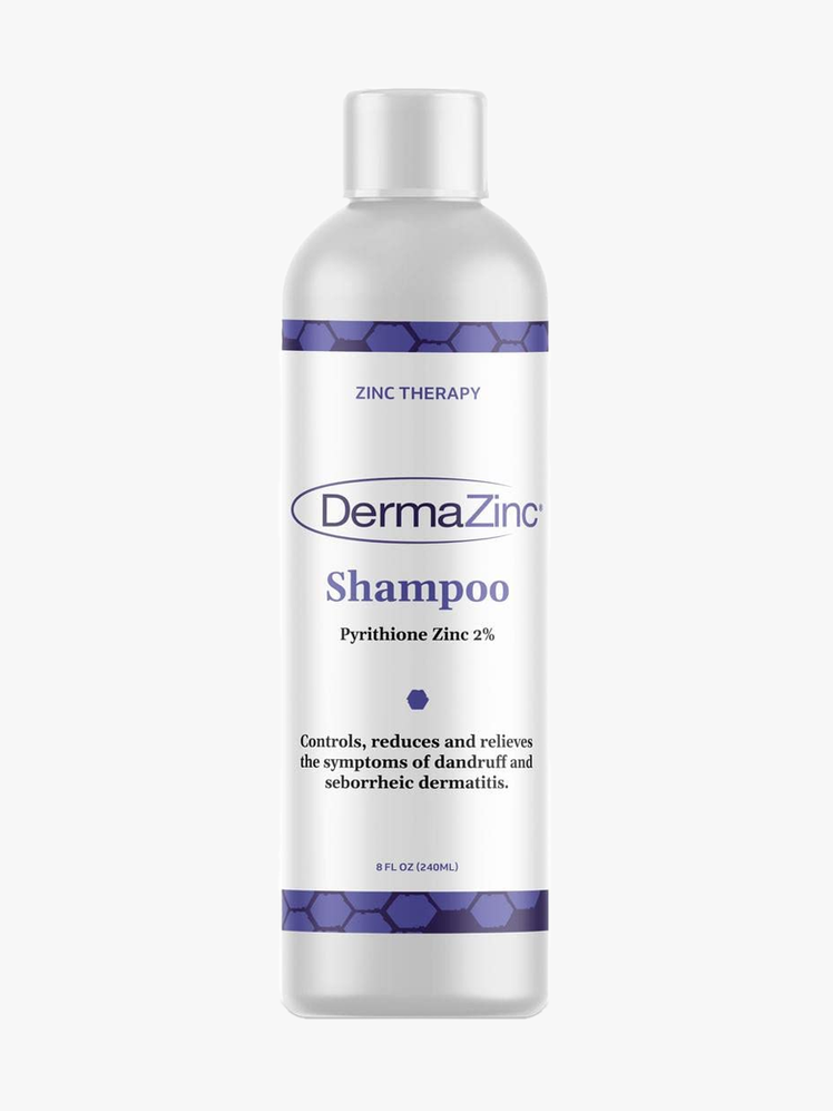 DermaZinc Shampoo in branded gray and purple bottle with cap on light gray background