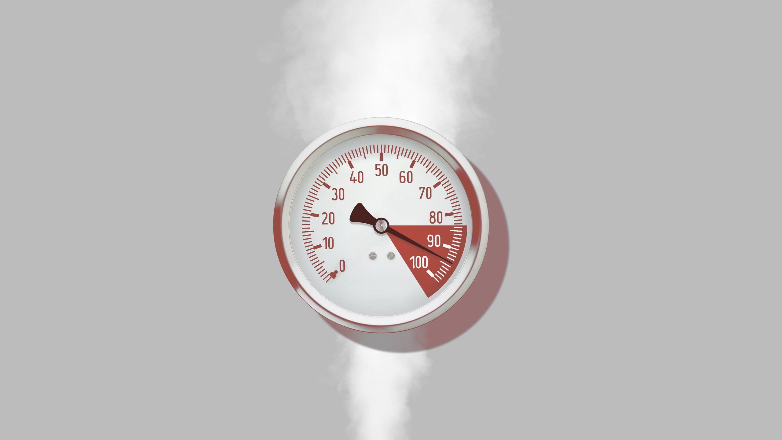 An image of a pressure gauge that is steaming with the needle pointing to the red zone.