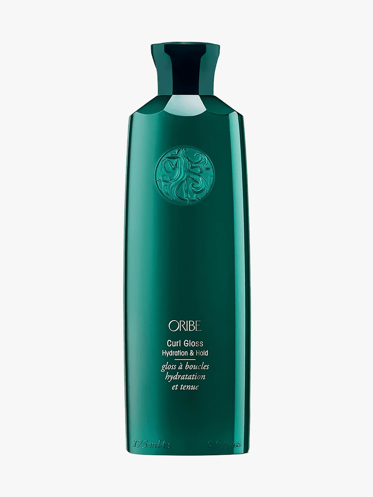 Oribe Curl Gloss in branded teal bottle on light gray background