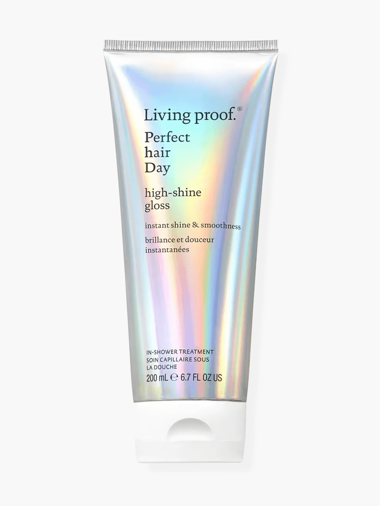 Living Proof Perfect Hair Day High-Shine Gloss in branded metallic tube with white cap on light gray background