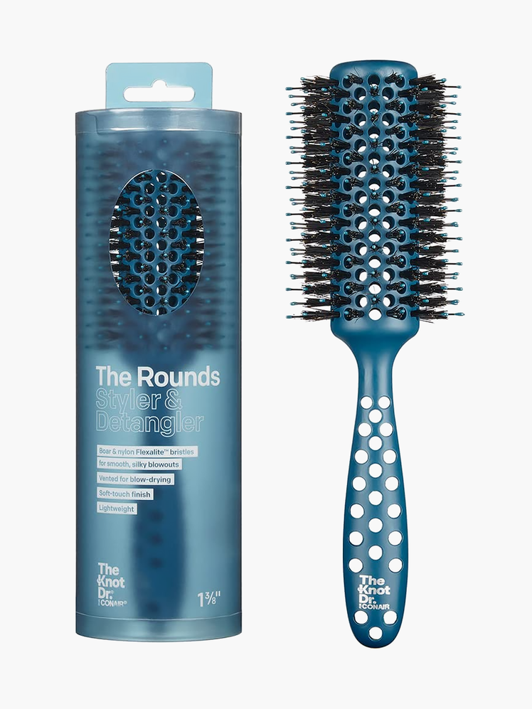 The Rounds Styler and Detangler in black and blue color way next to branded box packaging on light gray background