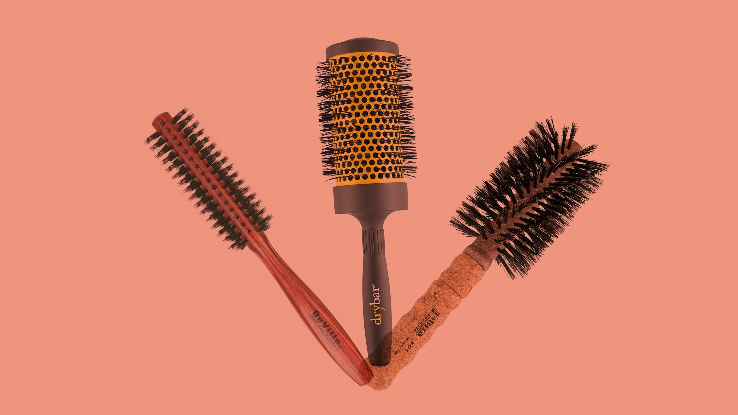 3 roundedbarrel hairbrushes items overlapping on a peach background