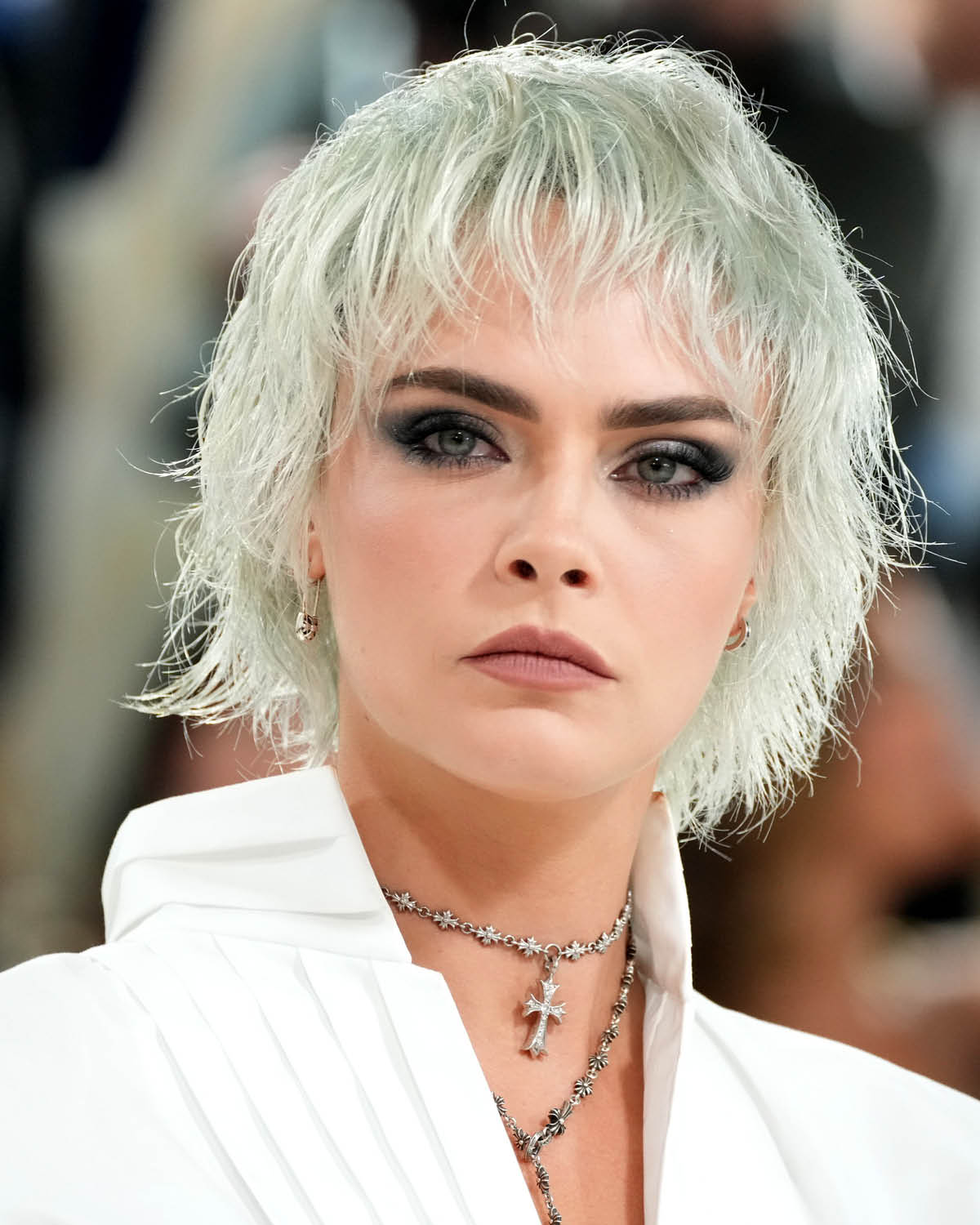 Cara Delevingne with blonde bixie wolf cut