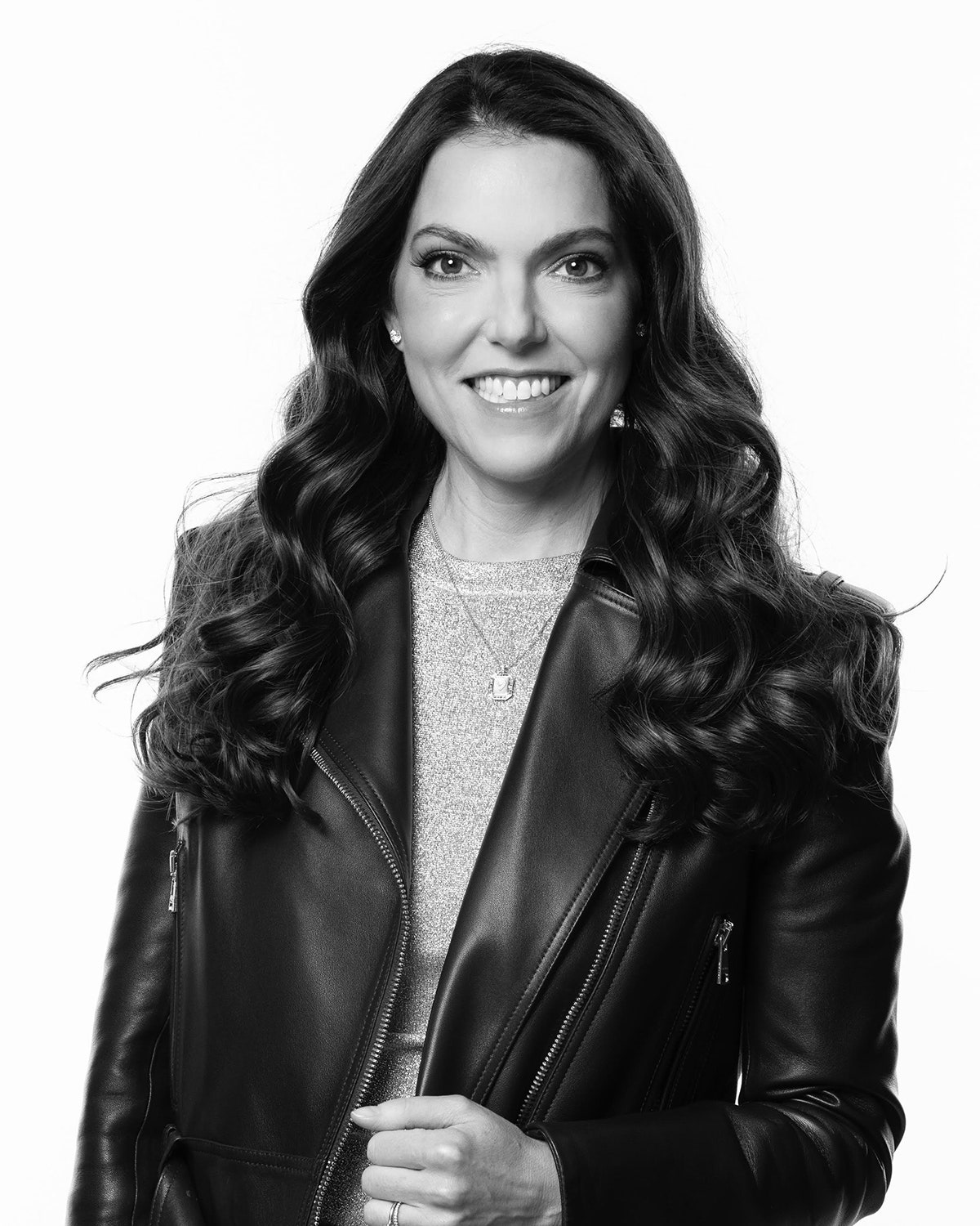 Dermatologist Rebecca Marcus shown in black and white wearing a black leather jacket