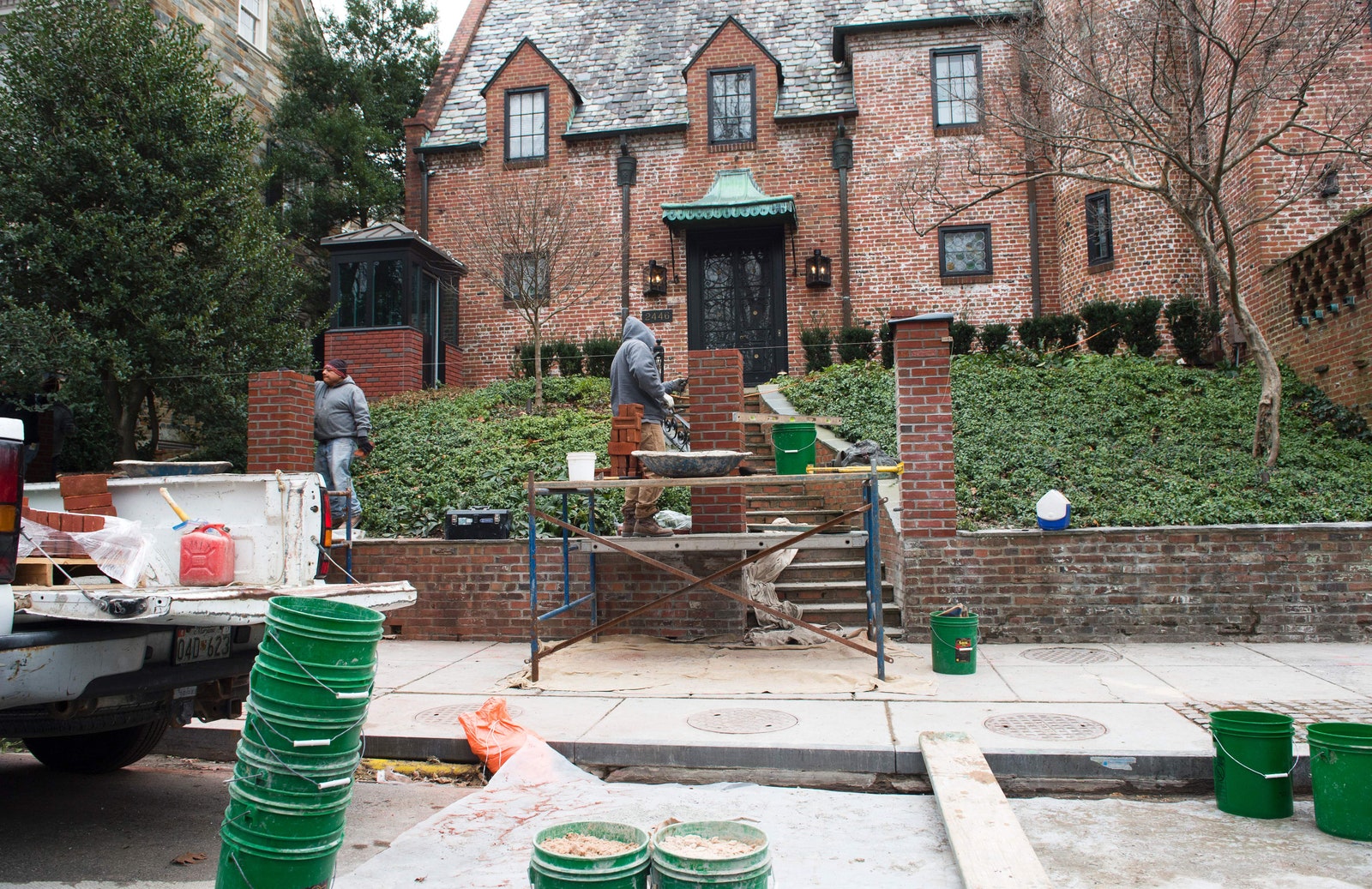 Image may contain Person Brick City Lamp Backyard Nature Outdoors Yard Cup Architecture Building and Housing