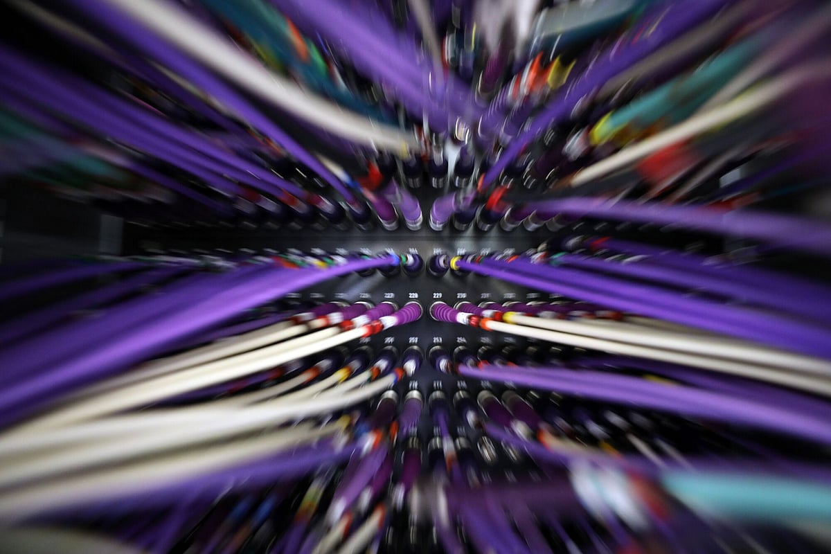 Coaxial cables connect to a computer server unit inside a communications room at an office in London, U.K., on Monday, May 15, 2017. Governments and companies around the world began to gain the upper hand against the first wave of an unrivaled global cyberattack, even as the assault was poised to continue claiming victims this week. Photographer: Chris Ratcliffe/Bloomberg