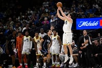 | Photo: AP/Phelan M. Ebenhack : NBA 2024-25: Jazz guard Svi Mykhailiuk (19) goes up to shoot a 3-point basket