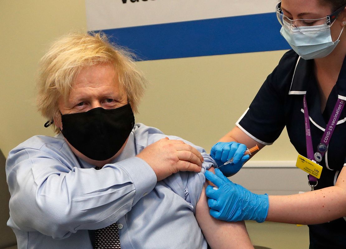 Boris Johnson receives his first dose of a AstraZeneca/Oxford Covid-19 vaccine at St. Thomas' Hospital in London on March 19, 2021. 