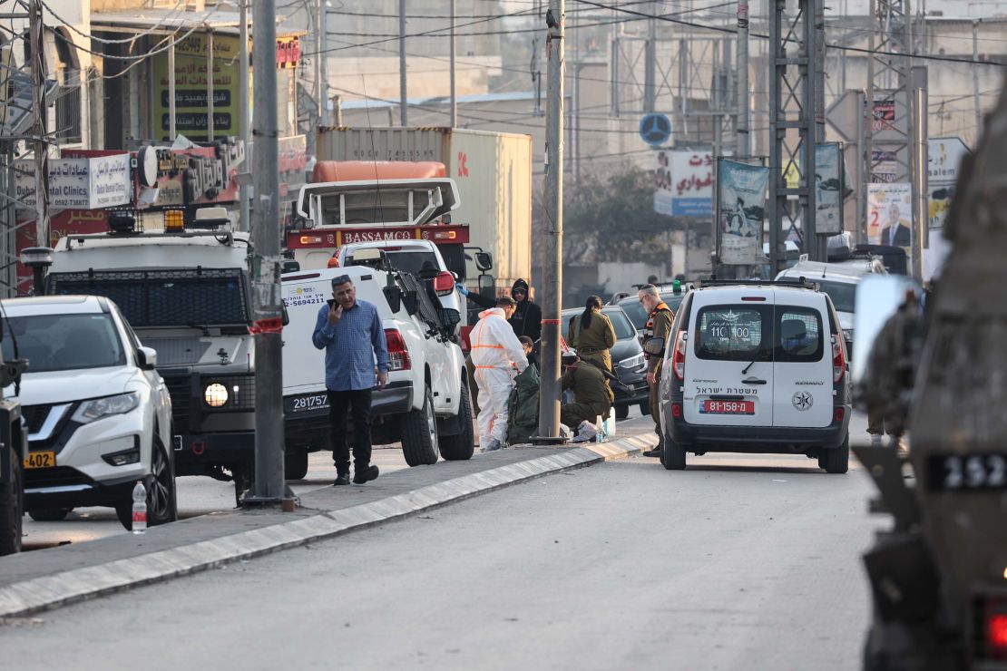 Israeli security forces  respond to the scene of the shooting attack that killed the Yaniv brothers.