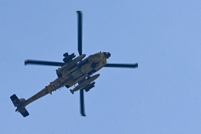 An Israeli military helicopter flies near the border between Gaza and Sderot, Israel, on October 12.